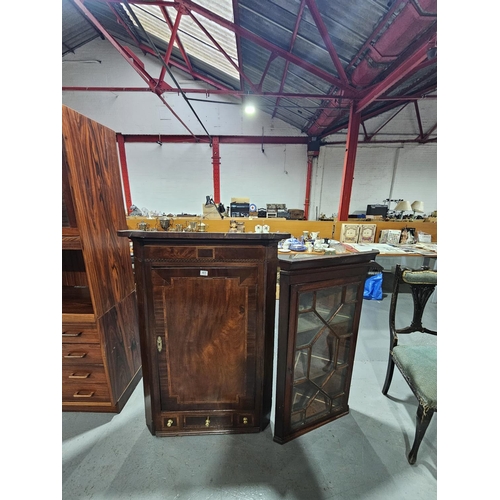 405 - Two wall hanging mahogany corner cabinets