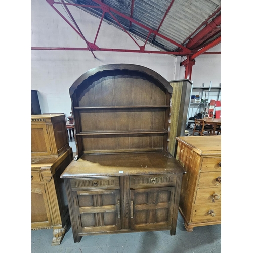 415 - An oak domed top dresser
H190cm  W122cm  D48cm