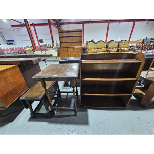 427 - An oak drop leaf side table, oak lamp table and a bookcase