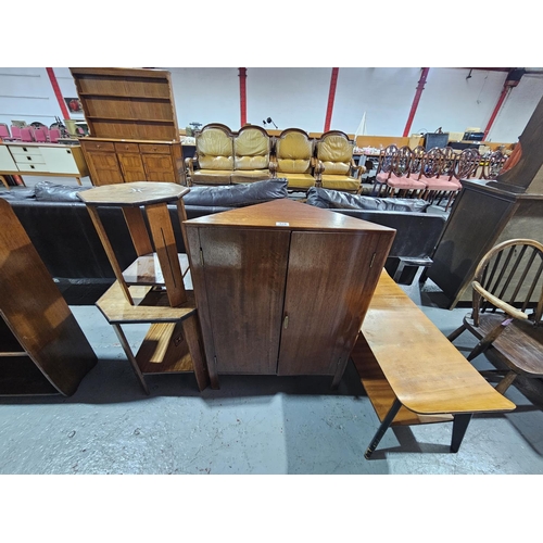 428 - A teak corner cabinet, two octagonal coffee tables and one other coffee table