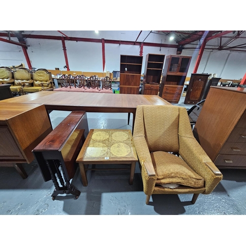 431 - A mahogany Sutherland table, upholstered armchair and a tiled coffee table