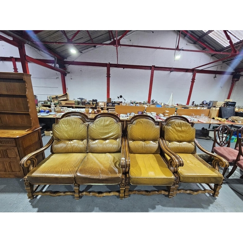 402 - A wooden framed leatherette upholstered cushioned two seater sofa and two armchairs