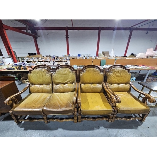 402 - A wooden framed leatherette upholstered cushioned two seater sofa and two armchairs