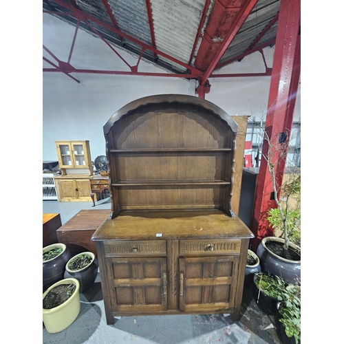 418 - An oak domed top dresser
H190cm  W122cm  D48cm