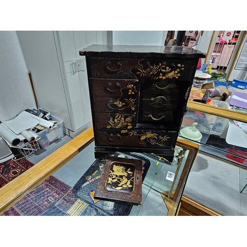 533 - A Japanese lacquer jewellery cabinet with drawers - 15 inches tall (door needs attaching)