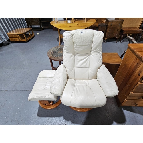 415 - A leatherette reclining swivel armchair with matching footstool