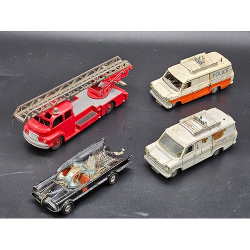 529 - Two playworn Dinky Police vans, a Playworn Corgi Batman car and a new Dinky 656 88mm gun