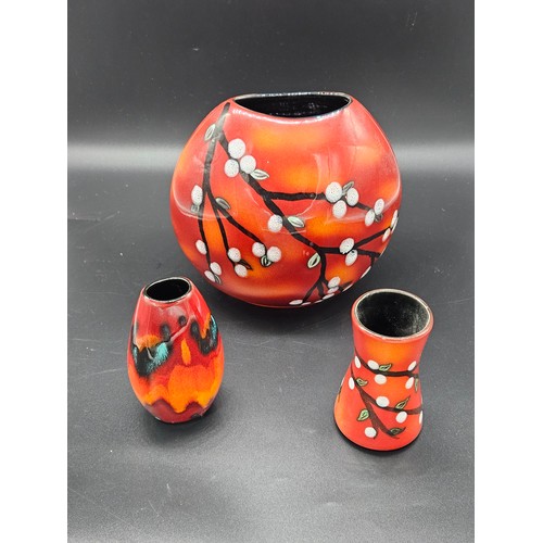 580 - Two Blossom pattern Poole volcanic vases - large vase 19cm tall and smaller one 11cm tall