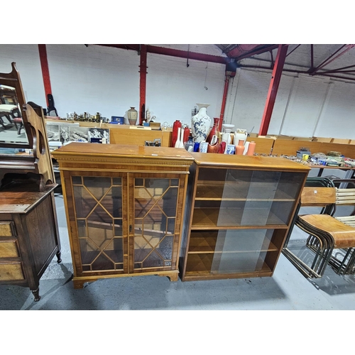 406 - An oak glass fronted bookcase together with a glazed front china cabinet