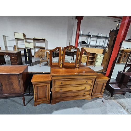 418 - A mahogany triple mirror dressing chest together with matching pair of bedside cabinets