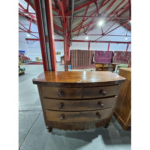 434 - A mahogany bow fronted two over two chest of drawers
Height 101cm  width 122cm  depth 52cm