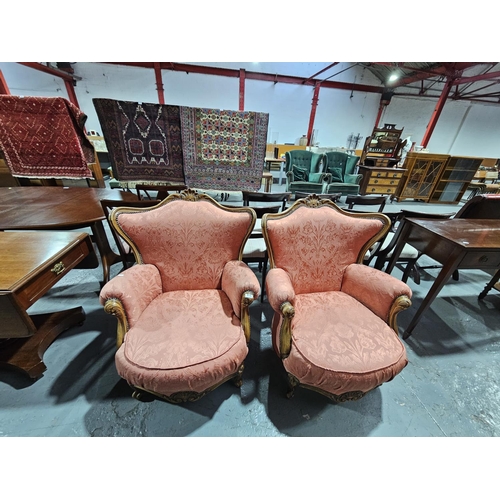 438 - A pair of upholstered French style armchairs