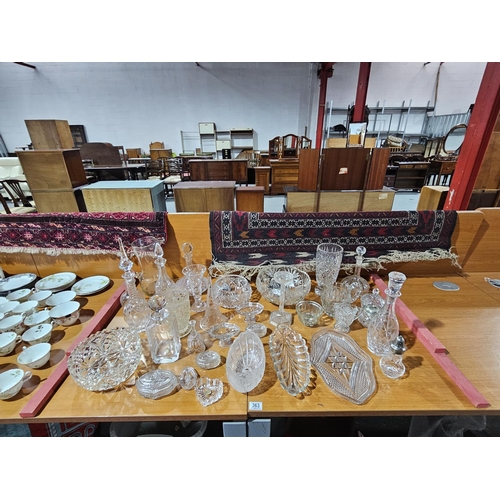 363 - A selection of mostly cut glass decanters, bowls, candlestick, vases, etc