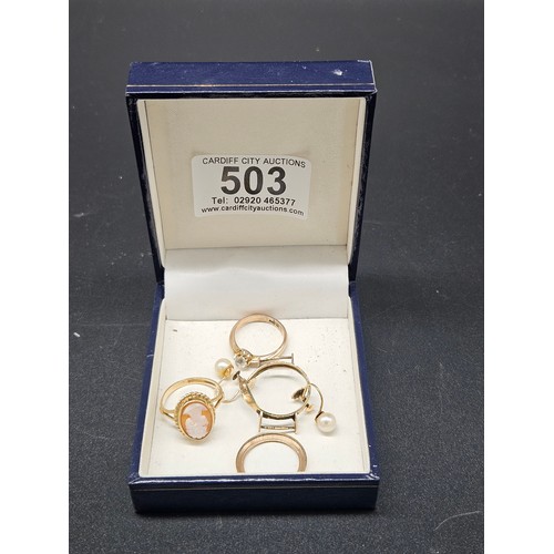 503 - A 9k gold cameo ring, another 9k ring, 9k pearl earrings and a scrap 9k gold watch case - total weig... 