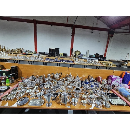 360 - A large quantity of silver plated tea and coffee pots, bowls, etc