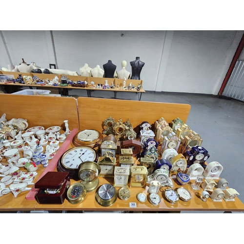 368 - A quantity of clocks - metal, china and carriage