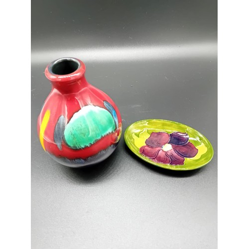 511 - A small Moorcroft pin dish together with a Poole pottery vase