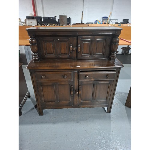 412 - An Ercol court cupboard
H124cm  W122cm  D48cm