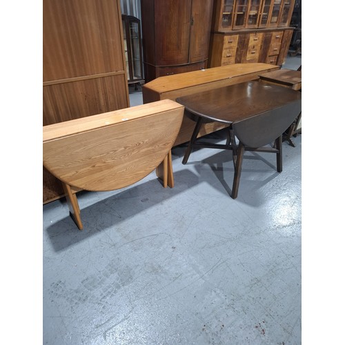 426 - An Ercol drop leaf dining table together with one other dining table