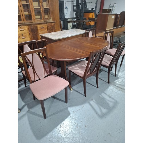 428 - A mahogany extending G Plan dining table with six chairs