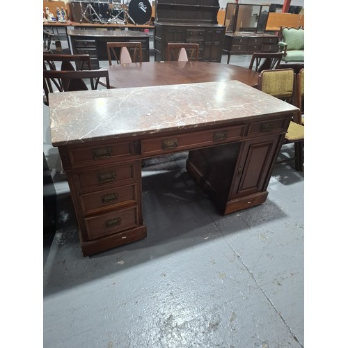 435 - An oak twin pedestal marble top desk