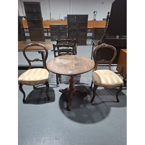 440 - A circular table on tripod base together with a pair of mahogany hall chairs