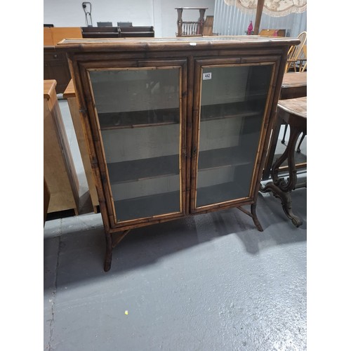 442 - A chinoiserie bamboo framed glazed display cabinet
H110cm  W100cm  D30cm