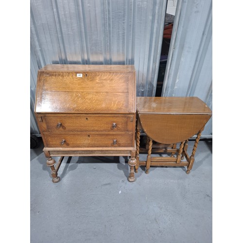 447 - An oak bureau together with a drop leaf side table