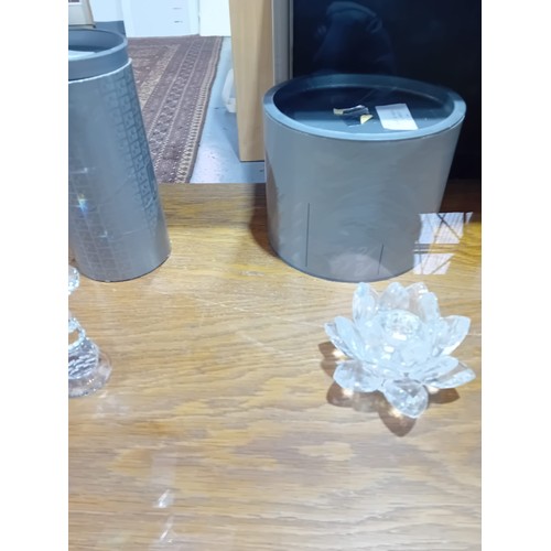 529 - A crystal Swarovski 'Shooting Star' candle holder and a crystal Swarovski 'Waterlily' candle holder ... 