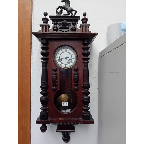 518 - A Vienna wall clock in a mahogany case