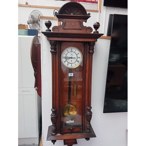 520 - A large mahogany cased Vienna wall clock with single weight