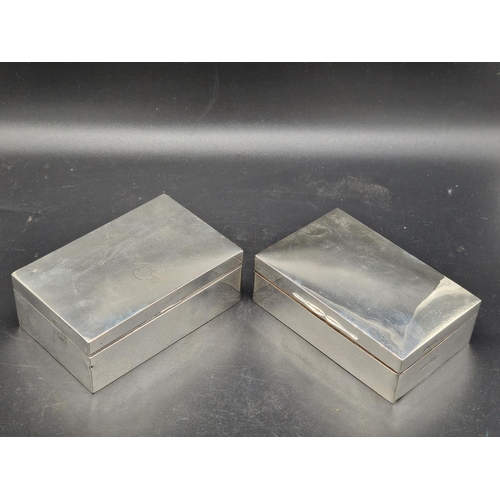 851 - Two hallmarked silver cigarette boxes - one with inscription - combined weight including wooden lini...