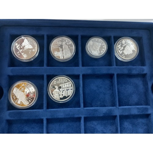 878 - A boxed collection of seventeen solid silver 