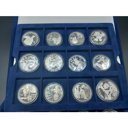 878 - A boxed collection of seventeen solid silver 