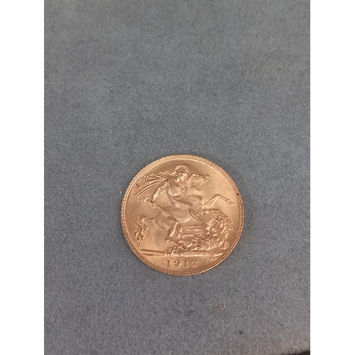 857 - A 1913 George IV half gold sovereign