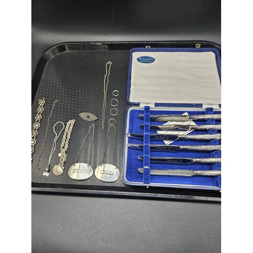 900 - Silver handled fruit knives in original box together with silver decanter labels, chains etc.