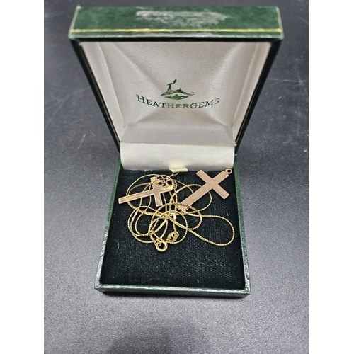 902 - Two 9 carat gold crosses and a chain - combined weight 4.3 grams
