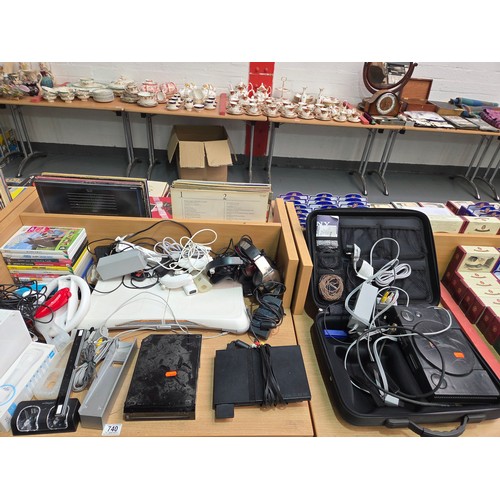 740 - Two Nintendo Wii consoles, Playstation 2 console with leads, controllers and accessories with an ass... 