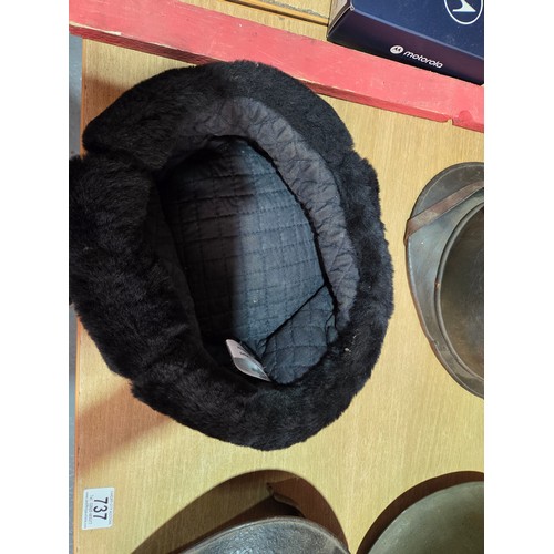 737 - Three military helmets together with a Russian Ushanka Soviet hat