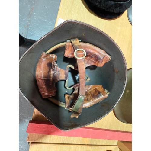 737 - Three military helmets together with a Russian Ushanka Soviet hat