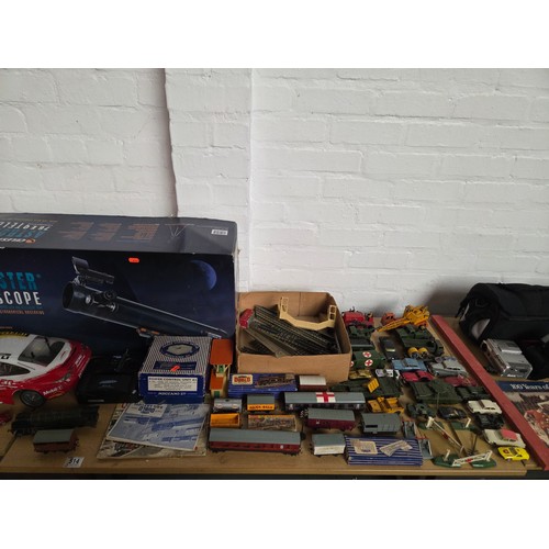 514 - A boxed Celestron Astromaster telescope with Hornby Dublo boxed train and track and playworn diecast... 