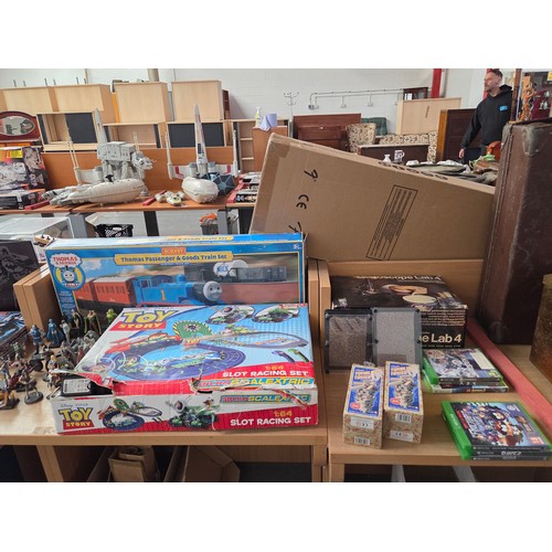 528 - A boxed Hornby Thomas the Tank train set, micro Scalextric Toy Story slot racing set with DC comics,... 