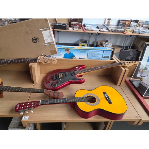 532 - A  Squire and Axis electric guitar together with an East coast and a Music Alley acoustic guitar