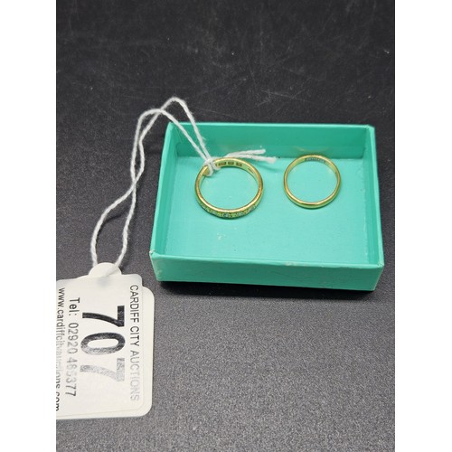 707 - Two 22 carat gold wedding bands - combined weight 6.6 grams