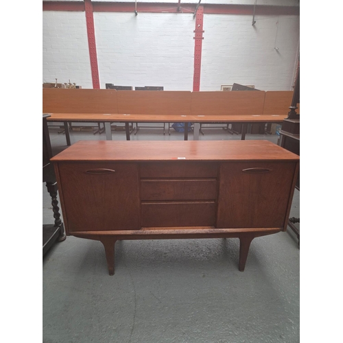 606 - A teak mid century sideboard
H75cm  W128cm  D45cm