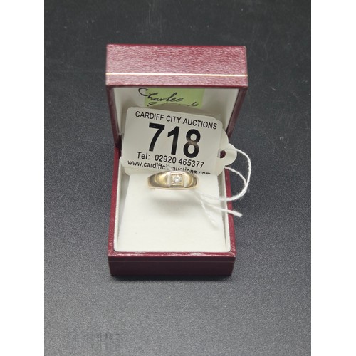 718 - An 18 carat gold ring with solitaire diamond - weight including diamond 4 grams