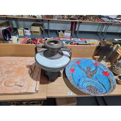 637 - A plaster Roman theme plaque, large pottery charger, wooden masks, together with other decorative va... 