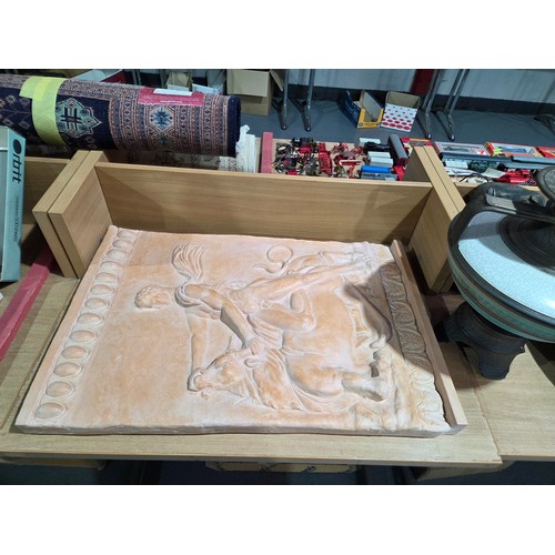 637 - A plaster Roman theme plaque, large pottery charger, wooden masks, together with other decorative va... 