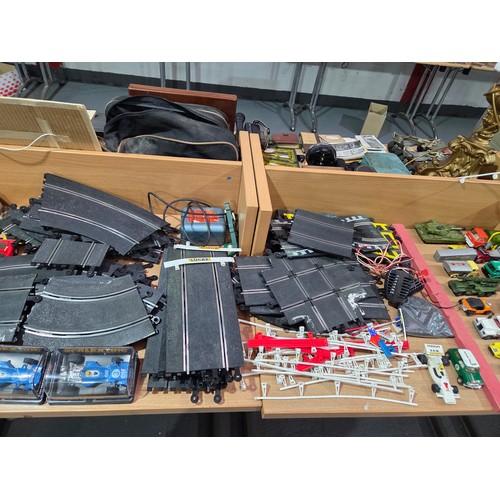 638 - A Scalextric set together with model railway track, carriages, trains, etc