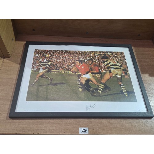529 - A framed signed photograph - limited edition 54/500 - signed by Welsh rugby player Phil Bennett with... 
